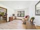 A bright room with hardwood floors and a large window with natural light at 3824 Oakwood Blvd, Anderson, IN 46011