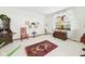 Sunlit room with hardwood floors, decorative rug and large window with curtains at 3824 Oakwood Blvd, Anderson, IN 46011