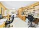 Large office featuring multiple work areas, built-in cabinets, and natural light at 3824 Oakwood Blvd, Anderson, IN 46011