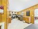 Functional office space with wood paneling, tile floors, and built-in storage at 3824 Oakwood Blvd, Anderson, IN 46011