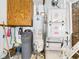 Well-maintained utility area with water heater, softener, and HVAC system for optimal home comfort and efficiency at 3824 Oakwood Blvd, Anderson, IN 46011