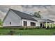 Beautiful exterior of home with white siding, complemented by well-maintained landscaping and lush green lawn at 3932 Besbie Way, Bargersville, IN 46106