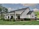 Rear view of a home with a covered porch, perfect for outdoor relaxation and entertaining at 3932 Besbie Way, Bargersville, IN 46106