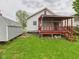 Backyard featuring a shed and a red-railed porch attached to the house at 411 Mccullen St, Chesterfield, IN 46017