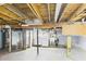 This basement features an unfinished laundry area with washer and dryer hookups at 411 Mccullen St, Chesterfield, IN 46017