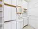 Bathroom features a sink and vanity combination with extra storage cabinets at 411 Mccullen St, Chesterfield, IN 46017