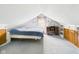 Attic bedroom offers carpeted floor, natural light, and a desk setup at 411 Mccullen St, Chesterfield, IN 46017