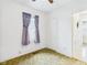 This bedroom features a neutral color scheme and natural light from the window at 411 Mccullen St, Chesterfield, IN 46017