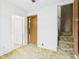 This bedroom offers natural light and access to the bathroom and the stairway at 411 Mccullen St, Chesterfield, IN 46017