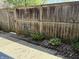 Fenced backyard showcasing a birdbath and various decorative plants at 4212 Foxglove Trce, Indianapolis, IN 46237