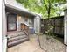 Backyard view, showing the side door, steps, and yard at 4212 Foxglove Trce, Indianapolis, IN 46237
