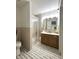 Well lit bathroom with single sink vanity and shower with glass doors at 4212 Foxglove Trce, Indianapolis, IN 46237