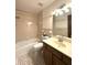 A traditionally styled bathroom with tub, toilet and sink at 4212 Foxglove Trce, Indianapolis, IN 46237
