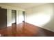Spacious bedroom with open closet spaces and glossy hardwood floors at 4212 Foxglove Trce, Indianapolis, IN 46237
