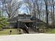 Exterior of a rustic building surrounded by mature trees at 4212 Foxglove Trce, Indianapolis, IN 46237
