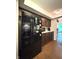 Functional kitchen featuring dark wood cabinets, modern appliances, and an adjacent dining area at 4212 Foxglove Trce, Indianapolis, IN 46237