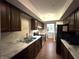 Modern kitchen with marble countertops, stainless steel appliances, and ample cabinet space at 4212 Foxglove Trce, Indianapolis, IN 46237
