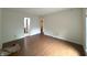 Bright living room with hardwood floors showcasing open doorway and natural light at 4212 Foxglove Trce, Indianapolis, IN 46237