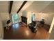 Bright living room featuring a fireplace, wood beams, and modern flooring at 4212 Foxglove Trce, Indianapolis, IN 46237