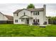 Spacious backyard view showcasing the home's exterior and patio with outdoor furniture at 4227 Short Ter, Carmel, IN 46033