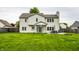 Full backyard with home, patio, outdoor furniture, and lush lawn, perfect for relaxation and entertainment at 4227 Short Ter, Carmel, IN 46033