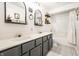 Spacious bathroom with double sinks, patterned floors, and shower-tub combo at 4227 Short Ter, Carmel, IN 46033