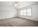 Spacious bedroom with vaulted ceiling, neutral carpet, and a large window with wooded views at 4227 Short Ter, Carmel, IN 46033