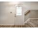Interior view of the entrance with a decorative front door, staircase, and wood-look flooring at 4227 Short Ter, Carmel, IN 46033