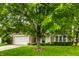 Beautiful two-story home with a brick facade, two-car garage, manicured lawn, and mature trees at 4227 Short Ter, Carmel, IN 46033