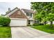 Charming two-story brick home featuring an attached two-car garage and a well-maintained front yard at 4227 Short Ter, Carmel, IN 46033