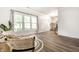 Bright living area featuring large windows, modern flooring, and neutral decor creating a peaceful ambiance at 4227 Short Ter, Carmel, IN 46033