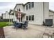 A concrete patio featuring an outdoor dining set under an umbrella, perfect for entertaining at 4227 Short Ter, Carmel, IN 46033