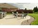 Beautiful backyard with a fire pit and comfortable seating for outdoor gatherings at 4396 Nigella Dr, Plainfield, IN 46168