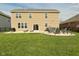 Spacious backyard with patio, hot tub, fire pit, and manicured lawn at 4396 Nigella Dr, Plainfield, IN 46168