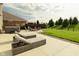 Large backyard with hot tub, fire pit, patio furniture, and green lawn at 4396 Nigella Dr, Plainfield, IN 46168