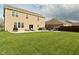 Well-kept backyard with a patio, hot tub, and fire pit for outdoor relaxation at 4396 Nigella Dr, Plainfield, IN 46168
