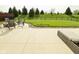 Expansive backyard with concrete patio and fire pit, perfect for outdoor entertaining at 4396 Nigella Dr, Plainfield, IN 46168