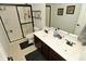 Bathroom features a double sink vanity, sleek tile floors, and a glass-enclosed walk-in shower at 4396 Nigella Dr, Plainfield, IN 46168
