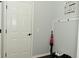 Clean entryway with white paneled door, decorative wall art, and coat rack at 4396 Nigella Dr, Plainfield, IN 46168