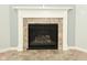 Close-up view of a tiled fireplace with a decorative white mantle at 4396 Nigella Dr, Plainfield, IN 46168