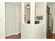 Hallway with a view to an office space and kitchen area, creating an open and inviting atmosphere at 4396 Nigella Dr, Plainfield, IN 46168