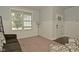 Bright living room with a window and wainscoting features a brown couch and an accent chair to provide cozy seating at 4396 Nigella Dr, Plainfield, IN 46168