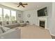 Living room featuring a fireplace, large sectional, and a calming neutral color palette for a relaxing space at 4396 Nigella Dr, Plainfield, IN 46168