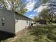 Spacious backyard with mature trees, patio area, and storage shed at 4456 N Kenyon Dr, Indianapolis, IN 46226