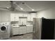 Bright kitchen with white cabinetry, stainless steel appliances, and modern fixtures at 4456 N Kenyon Dr, Indianapolis, IN 46226