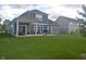 Spacious backyard with a covered patio perfect for entertaining and relaxation at 4518 W Meadows Ln, New Palestine, IN 46163