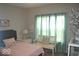 Serene bedroom with soft colors, comfortable bedding, and a bright window, creating a relaxing and inviting atmosphere at 4518 W Meadows Ln, New Palestine, IN 46163