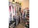 This walk-in closet is equipped with rods and shelves for ultimate organization at 4518 W Meadows Ln, New Palestine, IN 46163