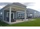 Cozy covered patio with string lights, outdoor furniture, and a grill for outdoor enjoyment at 4518 W Meadows Ln, New Palestine, IN 46163