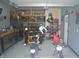 Well-organized garage with work area, ample storage, and high-end epoxy flooring at 4518 W Meadows Ln, New Palestine, IN 46163